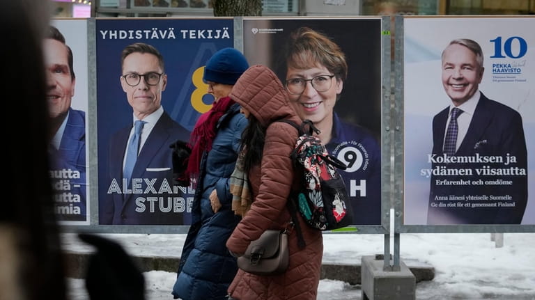 Election posters are displayed in Helsinki, Finland, Saturday, Jan. 27,...