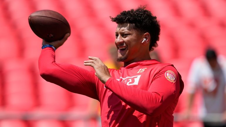 Kansas City Chiefs quarterback Patrick Mahomes warms up before an...