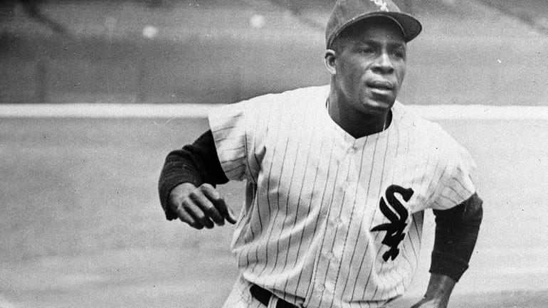 Minnie Minoso, Chicago White Sox outfielder, practices running the bases...