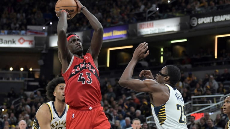 Toronto Raptors forward Pascal Siakam (43) shoots over Indiana Pacers...