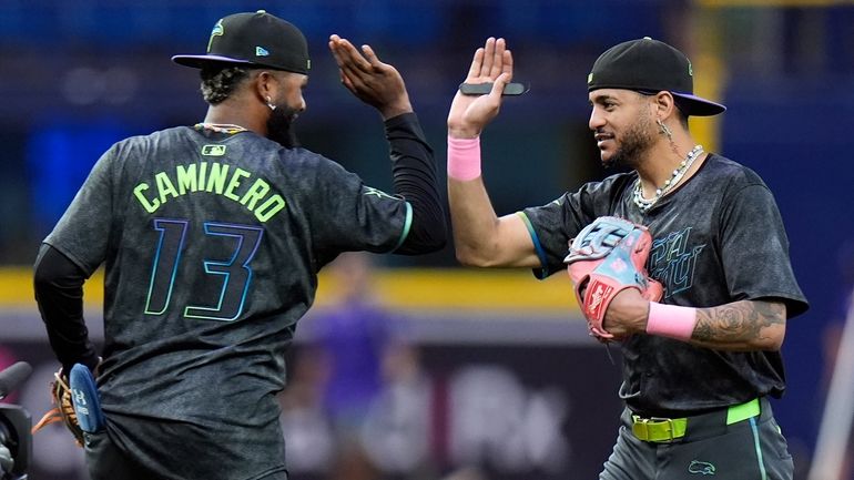 Tampa Bay Rays' Jose Siri celebrates with Junior Caminero (13)...