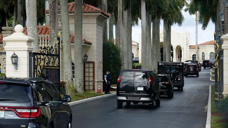 President Donald Trump's motorcade arrives at Trump International Golf Club,...
