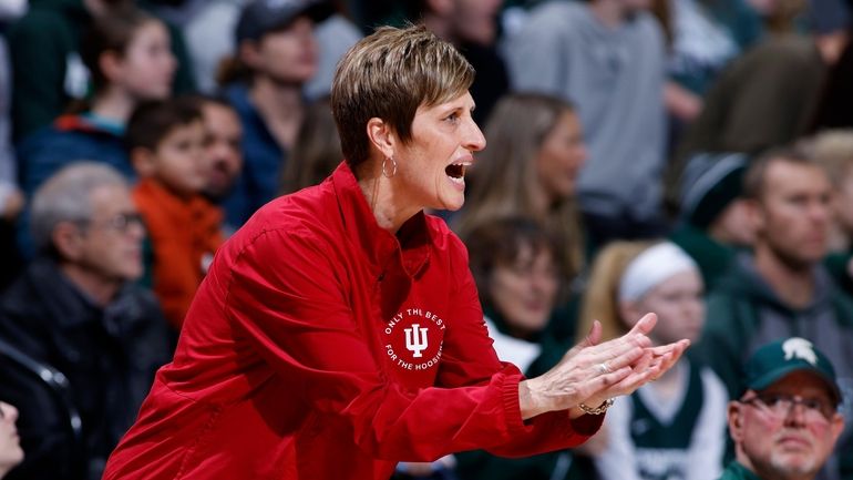 FILE - Indiana coach Teri Moren applauds during the first...