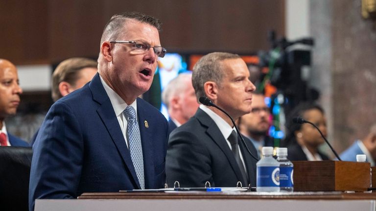 U.S. Secret Service Acting Director Ronald Rowe, left, and FBI...