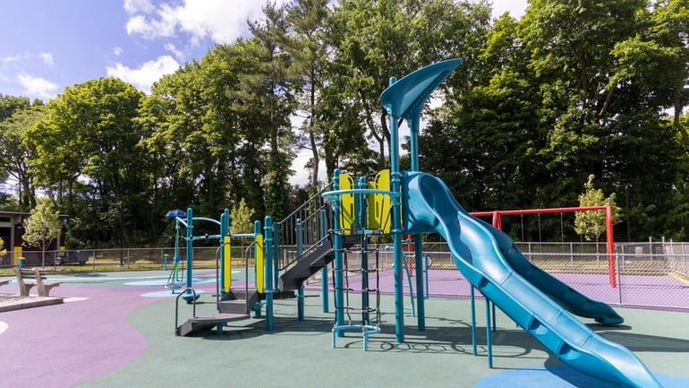 Renovations at Elmont Road Park, seen on June 22, include new playground...