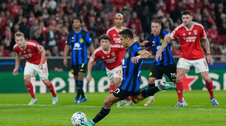 Inter Milan's Alexis Sanchez scores his side's third goal on...
