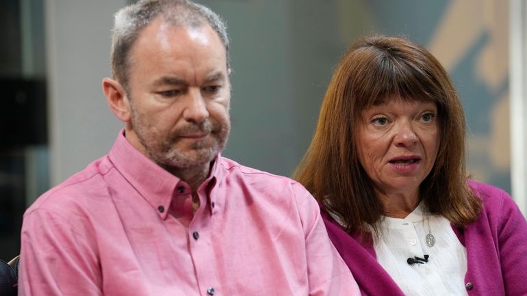 Simon Glass, left, and his wife, Sally Glass, talk about...