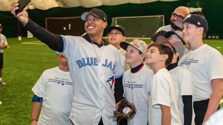 Toronto Blue Jays pitcher Marcus Stroman, of Medford, with young...