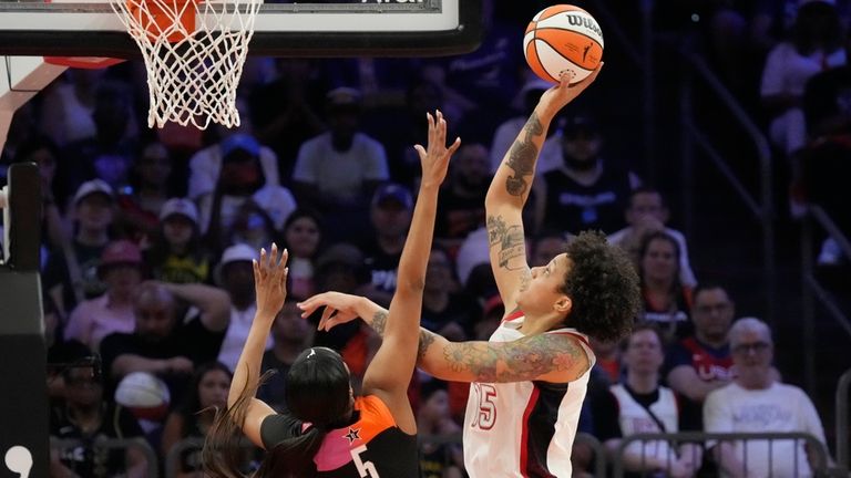 Brittney Griner (15), of Team USA, shoots over Angel Reese...