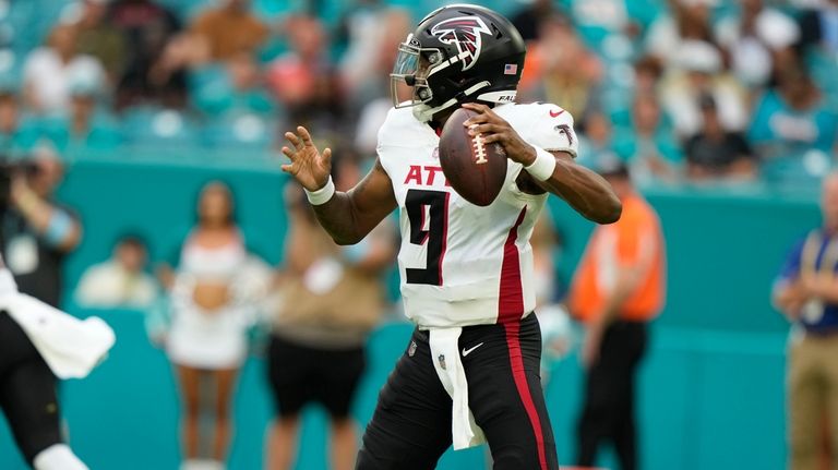 Atlanta Falcons quarterback Michael Penix Jr. (9) aims a pass...