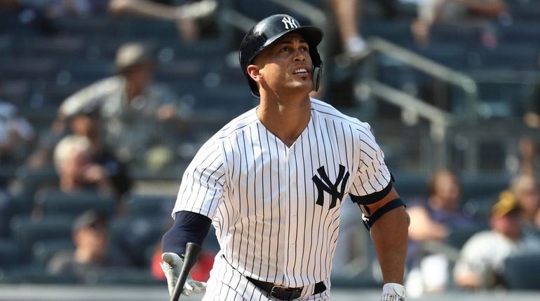 Giancarlo Stanton of the Yankees hits an RBI ground rule double...