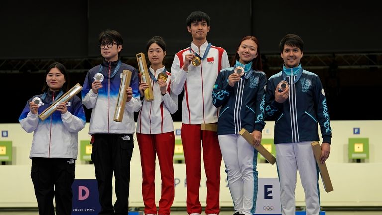 Medal winners pose for a photograph after the medal ceremony...