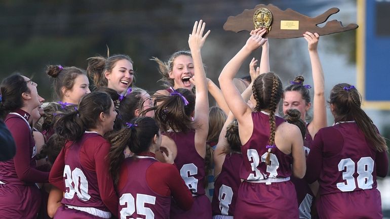 Garden City teammates celebrate after their 1-0 win over Eastport-South...