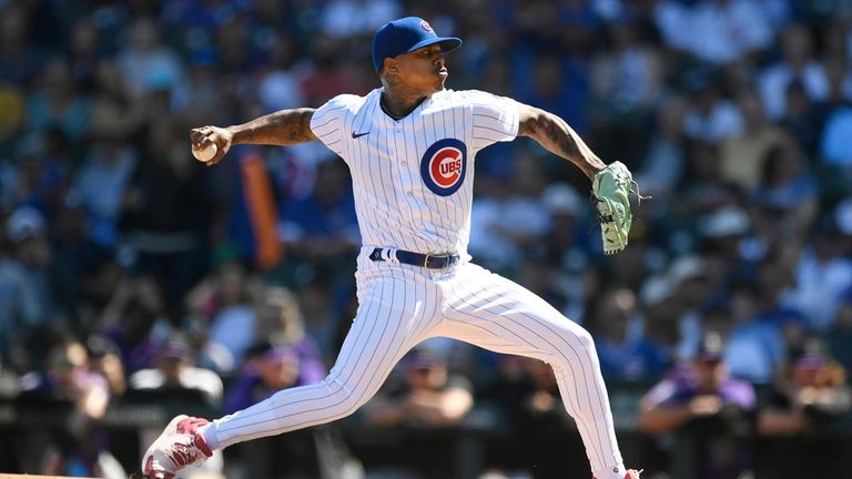 Chicago Cubs starter Marcus Stroman delivers a pitch during the...