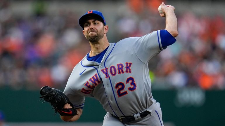 Mets starting pitcher David Peterson throws to the Orioles in...