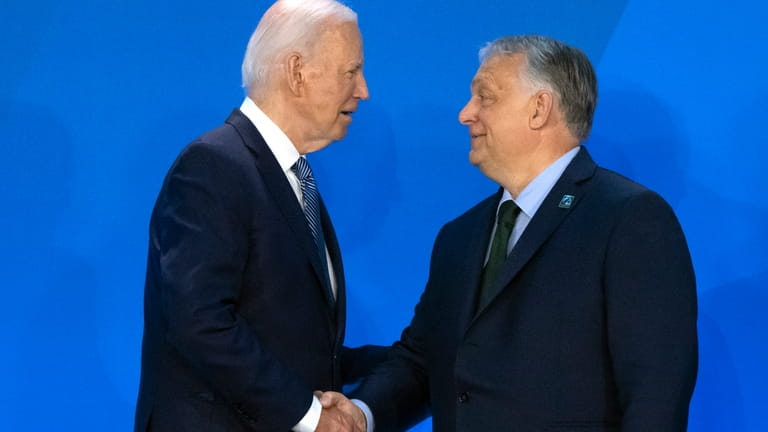 President Joe Biden, left, greets Viktor Orban, Prime Minister of...