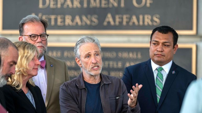 Jon Stewart speaks outside the Department of Veterans Affairs following...