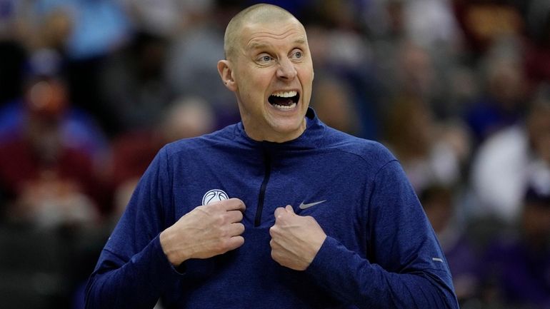 BYU head coach Mark Pope talks to his players during...