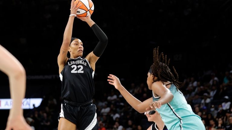 Las Vegas Aces center A'ja Wilson (22) shoots over New...