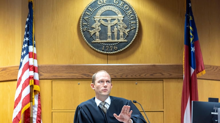 Fulton County Superior Court Judge Scott McAfee presides over a...