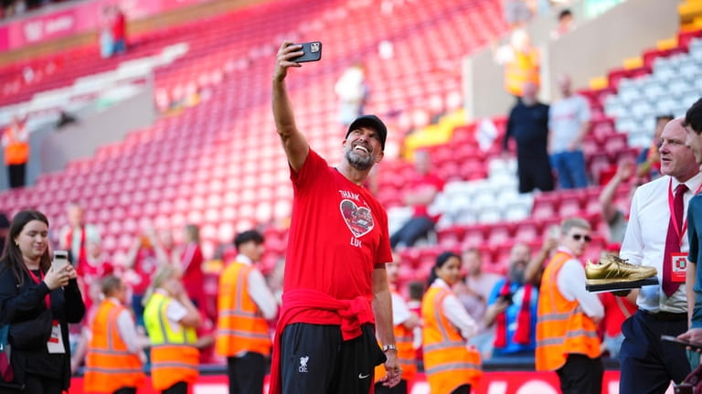 Jurgen Klopp takes a selfie after his final game as...
