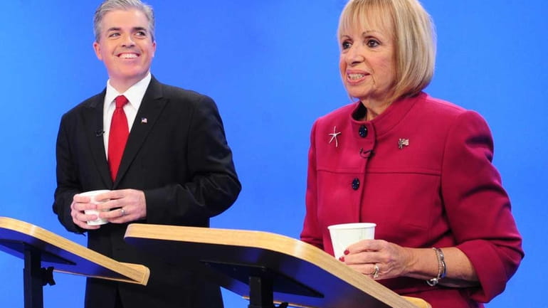 Suffolk County executive candidates Steve Bellone, left, and Angie Carpenter,...