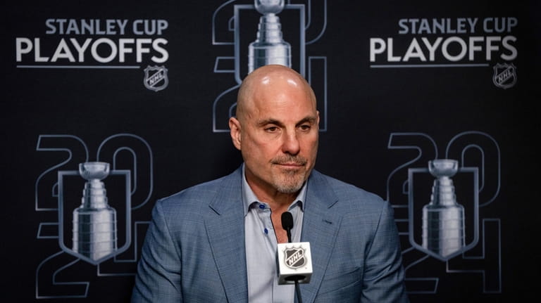Vancouver Canucks head coach Rick Tocchet speaks during a news...