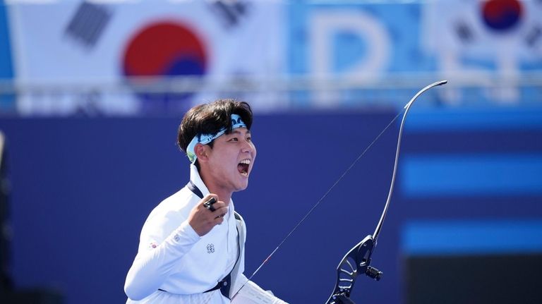 South Korea's Wooseok Lee celebrates winning during the men's team...