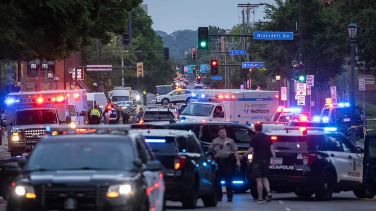 Law enforcement gathers on Franklin Avenue in Minneapolis, Thursday, May...