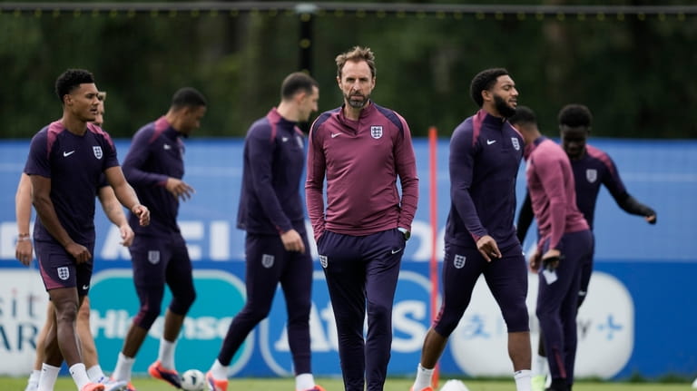 England's manager Gareth Southgate walks on the pitch during a...