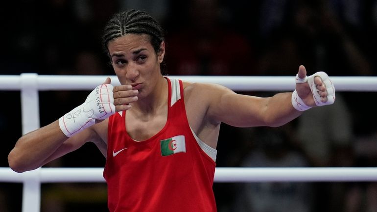 Algeria's Imane Khelif, celebrates after defeating Hungary's Anna Hamori in...