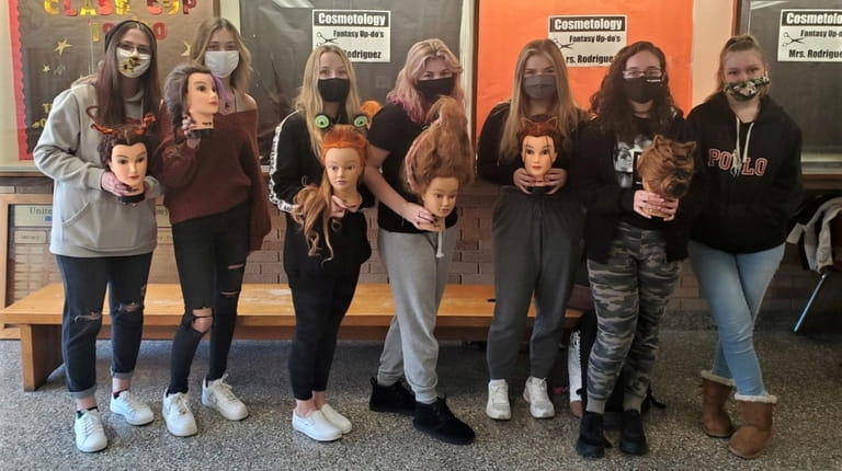East Islip High School's cosmetology students created fall-inspired fantasy updos...