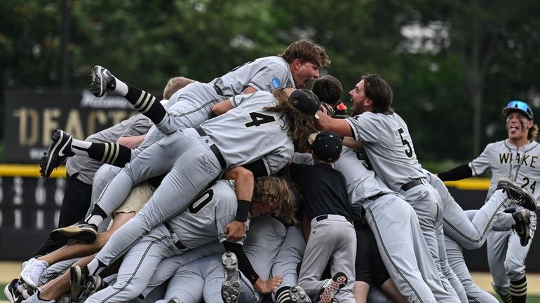 Wake Forest celebrates after winning an NCAA college baseball tournament...