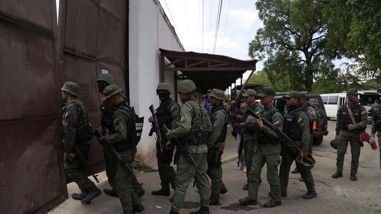 Soldiers raid the Tocorón Penitentiary Center, in Tocorón, Venezuela, Wednesday,...