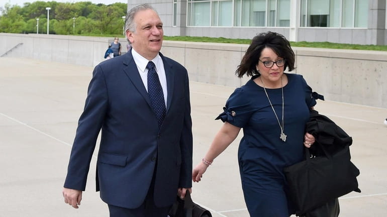 Edward and Linda Mangano arrive at federal court in Central...