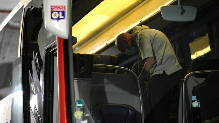 Police take finger prints in a bus that the Lyon...