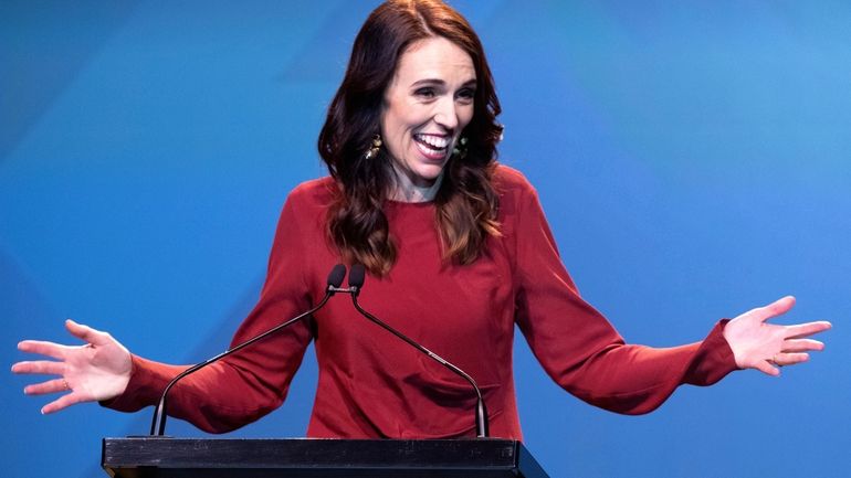 New Zealand Prime Minister Jacinda Ardern gestures as she gives...