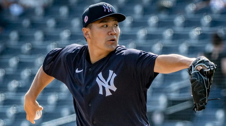 Yankees pitcher Masahiro Tanaka throws during spring training in Tampa, Fla., on Feb....