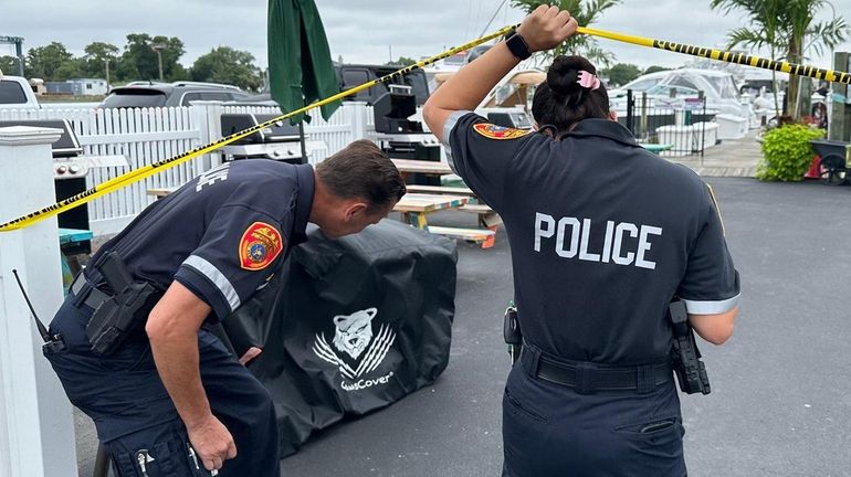 Suffolk County police Sunday morning at the Oakdale Yacht Club on...