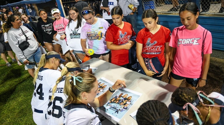 The New York Rise sign autographs for fans at their home...