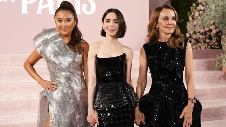 Ashley Park, from left, Lily Collins and Philippine Leroy-Beaulieu arrive...