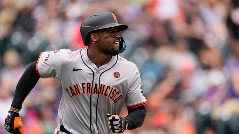 San Francisco Giants' Jorge Soler heads up the first-base line...