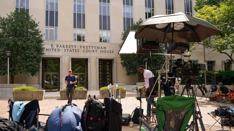 Members of the media outside E. Barrett Prettyman US Federal...