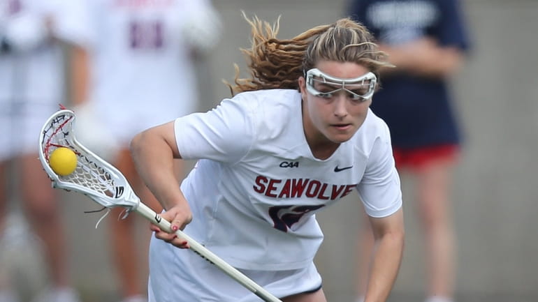 Stony Brook midfielder Ellie Masera carries the ball in the second quarter...