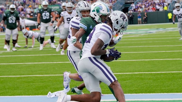 Kansas State safety VJ Payne (19) grabs an interception against...