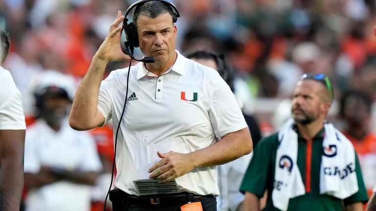 Miami head coach Mario Cristobal watches from the sideline during...