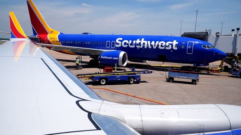 A Southwest Airlines Boeing 737 passenger jet sits at a...