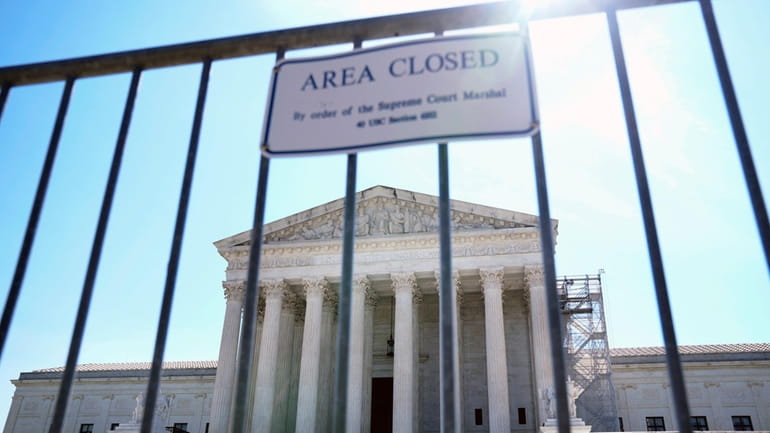 Fencing is seen outside the Supreme Court, Tuesday, June 25,...