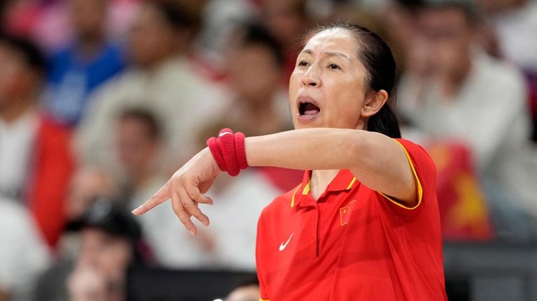 China head coach Zheng Wei gestures during a women's basketball...