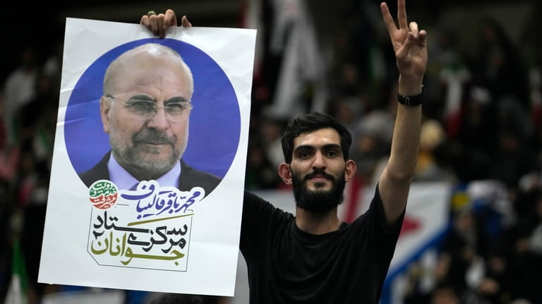 A supporter of Iran's parliament speaker Mohammad Bagher Qalibaf, the...